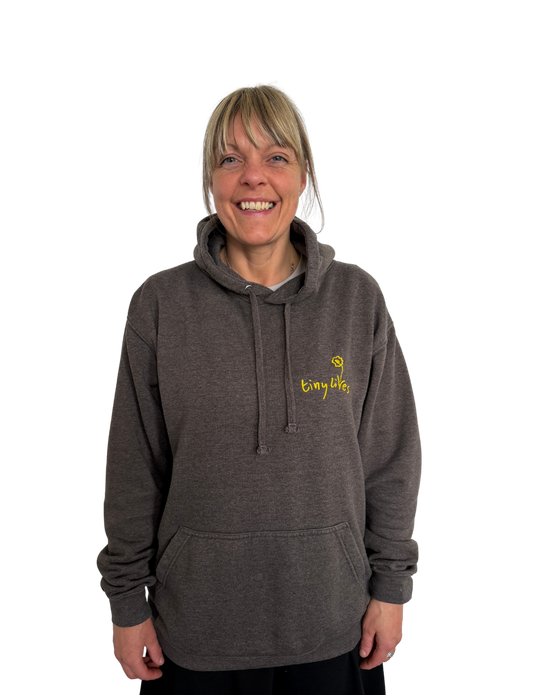 A Tiny Lives Adult Hoodie in brown